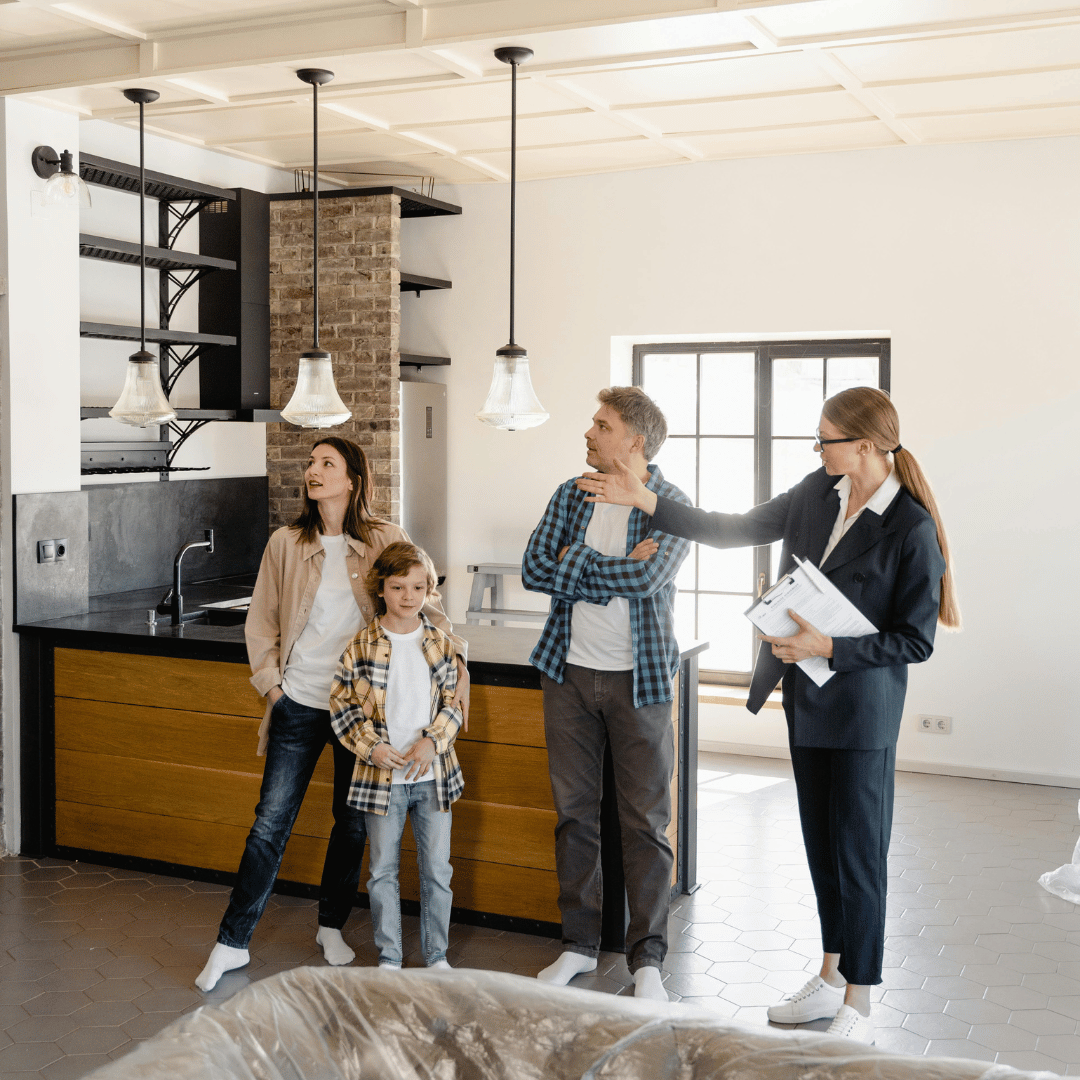 An Agent Showing a House to Her Clients
